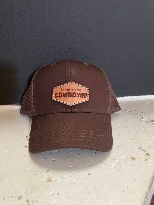 Infant cowboy in’ brown hat